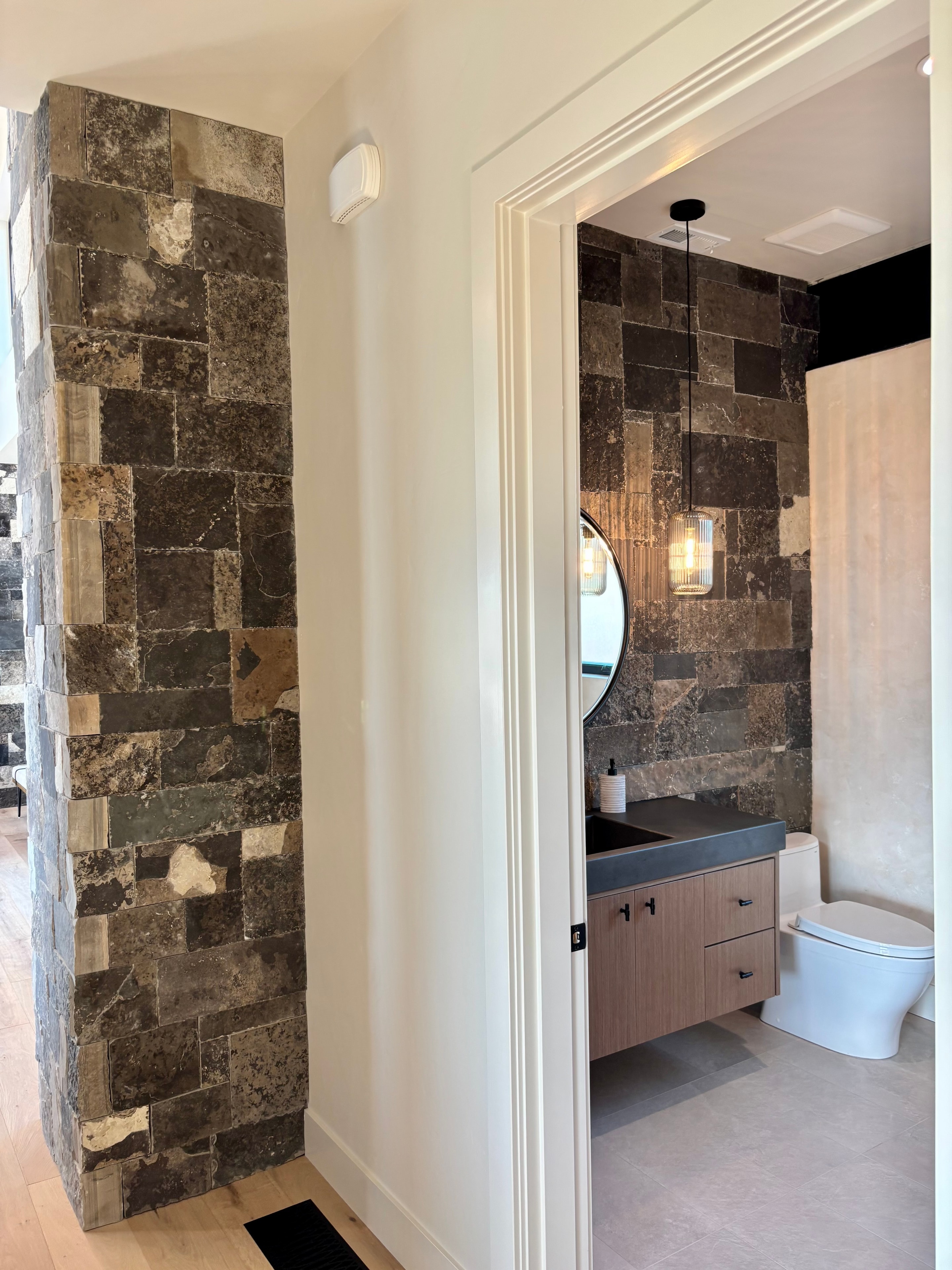 Dark Stone Column & Bathroom Feature